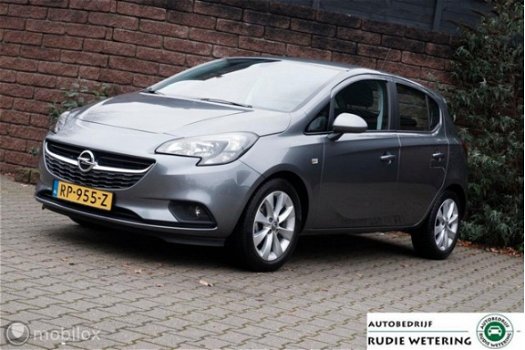 Opel Corsa - 1.4 90PK Favourite nav/tel/pdc/lmv16 - 1
