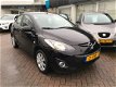 Mazda 2 - 2 1.3HP TS+ Clima LM velgen El. ramen 33.371km - 1 - Thumbnail