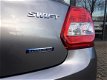 Suzuki Swift - 1.2 Select | Voorraad | Airco | Stoelverwarming | Navigatie | Apple Carplay | Lichtme - 1 - Thumbnail