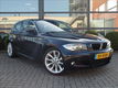 BMW 1-serie - 118i High Executive*M-sportpakket*Kantelschuifdak*Halfleder sport interieur*103.500 KM - 1 - Thumbnail