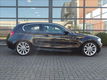 BMW 1-serie - 118i High Executive*M-sportpakket*Kantelschuifdak*Halfleder sport interieur*103.500 KM - 1 - Thumbnail