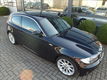 BMW 1-serie - 118i High Executive*M-sportpakket*Kantelschuifdak*Halfleder sport interieur*103.500 KM - 1 - Thumbnail