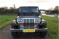 Jeep Wrangler - 2.5i Softtop Nette staat - 1 - Thumbnail