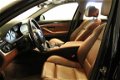 BMW 5-serie - (J) 528i High Executive Aut [ FM Navi Leer Schuifkanteldak Clima Cruise PDC ] - 1 - Thumbnail