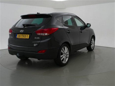 Hyundai ix35 - 2.0i 164 PK 4WD i-CATCHER + PANORAMA / LEDER / NAVIGATIE / TREKHAAK - 1