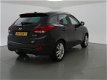 Hyundai ix35 - 2.0i 164 PK 4WD i-CATCHER + PANORAMA / LEDER / NAVIGATIE / TREKHAAK - 1 - Thumbnail