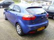 Kia Rio - 1.2 CVVT Super Pack , Clima, Cruis, LED, Trekhaak, Startstop, Elektr. pak., Inruil Mog - 1 - Thumbnail