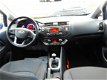 Kia Rio - 1.2 CVVT Super Pack , Clima, Cruis, LED, Trekhaak, Startstop, Elektr. pak., Inruil Mog - 1 - Thumbnail