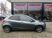 Mazda 2 - 2 1.3 BIFUEL Navigator GT lage kilometerstand, airconditioning, LPG - 1 - Thumbnail