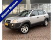 Hyundai Tucson - 2.0i Active airco, radio cd-speler, elektrische ramen, mistlampen voor - 1 - Thumbnail