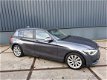 BMW 1-serie - 118i Leder Xenon Navi Professional VOL December aanbieding bij geen inruil 12450 - 1 - Thumbnail