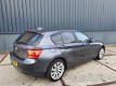 BMW 1-serie - 118i Leder Xenon Navi Professional VOL December aanbieding bij geen inruil 12450 - 1 - Thumbnail