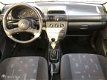 Opel Corsa - 1.4i Strada 5-drs [APK 29-06-2020] - 1 - Thumbnail