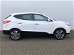 Hyundai ix35 - 2.0i 4WD i-Catcher Automaat RIJKLAAR panoramadak, zwart lederen bekleding, full map n - 1 - Thumbnail