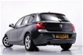 BMW 1-serie - 114i EDE Upgrade Edition Navigatie Leder Parkeersensoren Xenon 5-Deurs - 1 - Thumbnail