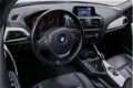 BMW 1-serie - 114i EDE Upgrade Edition Navigatie Leder Parkeersensoren Xenon 5-Deurs - 1 - Thumbnail