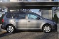 Volkswagen Touran - 1.4 TSI 140pk Comfortline 7p. | Navigatie | Winterpakket | PDC | Trekhaak - 1 - Thumbnail