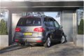 Volkswagen Touran - 1.4 TSI 140pk Comfortline 7p. | Navigatie | Winterpakket | PDC | Trekhaak - 1 - Thumbnail