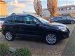 Volkswagen Tiguan - 1.4 TSI 150PK 4WD trekh navi NAP NL-auto - 1 - Thumbnail