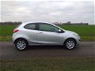 Mazda 2 - 2 1.3 TS Plus BJ 2011 54731km airco cv nieuwe apk nette auto - 1 - Thumbnail