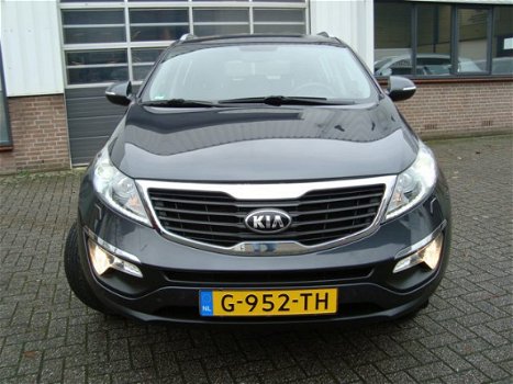 Kia Sportage - PLUS PACK SUV HOGE INSTAP NAVIGATIE CAMERA XENON LED CRUISE HALF LEDER LMV FABR. GARA - 1