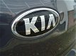 Kia Sportage - PLUS PACK SUV HOGE INSTAP NAVIGATIE CAMERA XENON LED CRUISE HALF LEDER LMV FABR. GARA - 1 - Thumbnail