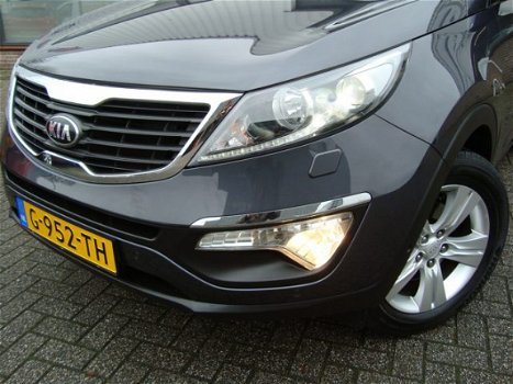 Kia Sportage - PLUS PACK SUV HOGE INSTAP NAVIGATIE CAMERA XENON LED CRUISE HALF LEDER LMV FABR. GARA - 1