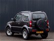 Suzuki Jimny - 1.3 exclusive 4WD 22000KM Airco, leer - 1 - Thumbnail