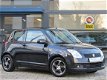 Suzuki Swift - 1.5 Exclusive All Black / Airco / LM Velgen + LM Velgen met Winter Banden / APK - 1 - Thumbnail