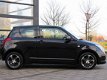 Suzuki Swift - 1.5 Exclusive All Black / Airco / LM Velgen + LM Velgen met Winter Banden / APK - 1 - Thumbnail