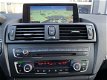 BMW 1-serie - 118i Sport Automaat, Xenon, Prof Nav, Nieuwe ketting, Sunroof, stoelverw, PDC V+A, LM - 1 - Thumbnail