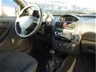 Opel Corsa - 1.2-16v Comfort - 5 Deurs - Airco - 1 - Thumbnail