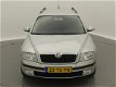 Skoda Octavia Combi - 1.6 Ambiente / airco / cruise / trekhaak / zilver-metallic - 1 - Thumbnail