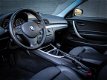 BMW 1-serie Coupé - 125i High Executive 218 PK / Climatronic / Navigatie / PDC - 1 - Thumbnail