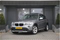 BMW X1 - sDrive18i Executive | Panoramadak | Navigatie | Stoelverwarming | Bi-Xenon - 1 - Thumbnail