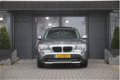 BMW X1 - sDrive18i Executive | Panoramadak | Navigatie | Stoelverwarming | Bi-Xenon - 1 - Thumbnail