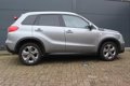 Suzuki Vitara - 1.6 2WD Aut Exclusive Navi, Cruise, org.NL Auto - 1 - Thumbnail