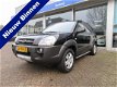 Hyundai Tucson - 2.0i Dynamic Cross Dealer onderhouden/ Cruise control/ Airco/ Parkeersensoren - 1 - Thumbnail