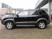 Hyundai Tucson - 2.0i Dynamic Cross Dealer onderhouden/ Cruise control/ Airco/ Parkeersensoren - 1 - Thumbnail