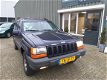 Jeep Grand Cherokee - 4.0i Laredo - 1 - Thumbnail