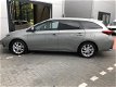 Toyota Auris Touring Sports - 1.8 Hybrid Navi Pano dak NL auto - 1 - Thumbnail