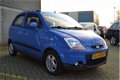 Chevrolet Matiz - 1.0 4 CIL / 5 DEURS / 4 ELEKTR.RAMEN / AIRCO / PARKEERSENSOREN - 1 - Thumbnail