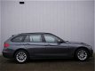 BMW 3-serie Touring - 316d 116pk High Executive xenon / leer / 16inch / navigatie - 1 - Thumbnail