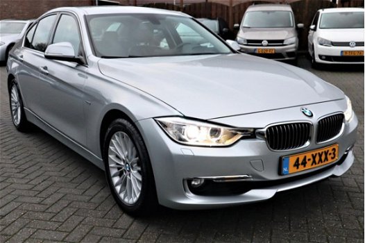 BMW 3-serie - 320i High Executive | Automaat | Xenon | Navigatie | Stoelverwarming | Comfort Leder | - 1