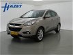 Hyundai ix35 - 2.0i AUT. 164 PK 4WD I-CATCHER + PANORAMA / LEDER / CAMERA / NAVIGATIE - 1 - Thumbnail