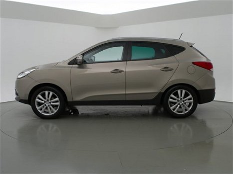 Hyundai ix35 - 2.0i AUT. 164 PK 4WD I-CATCHER + PANORAMA / LEDER / CAMERA / NAVIGATIE - 1