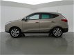 Hyundai ix35 - 2.0i AUT. 164 PK 4WD I-CATCHER + PANORAMA / LEDER / CAMERA / NAVIGATIE - 1 - Thumbnail