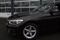 BMW 1-serie - 118i EDE Corporate Lease Essential | AUDIO-NAVI SYSTEEM BUSINESS / SPARKLING BROWN MET - 1 - Thumbnail