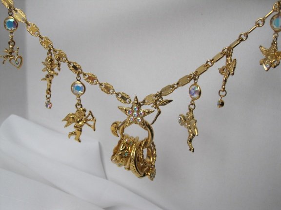 Ketting Kirks Folly goudkleurig met fabelachtige bedels en ringen 76 cm - Afbeelding 2