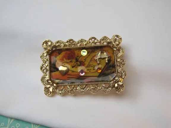 Broche 1928 jewelry compagny goudkleurigen emaille lijstje Forget me not 5.6x3.7 cm. - nr. 1